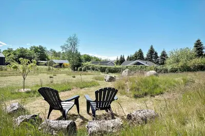 two chairs sitting in the middle of a field at JB164-Fjerritslev-Poppelvej-16 in Fjerritslev