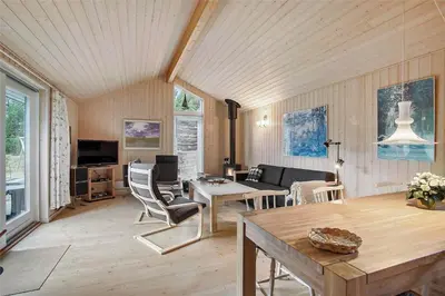 a living room with a couch and a table at JB136-Brovst-Harestien-1 in Brovst