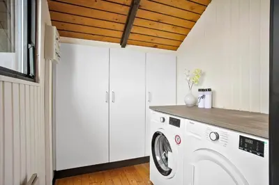 a white laundry room with a washer and dryer at JB229-Fjerritslev-Hasselvej-13 in Fjerritslev