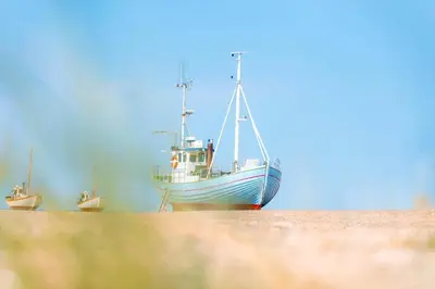 a boat sitting in the sand on the beach at JB302-Fjerritslev-Slettestrandvej-134-lejl-6 in Fjerritslev