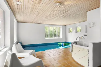 a bathroom with a swimming pool in the floor at JB305-Fjerritslev-Tyttebaerstien-18 in Fjerritslev