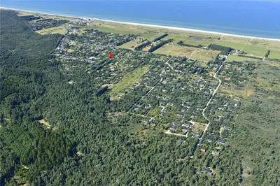 an aerial view of a city with trees and the ocean at JB305-Fjerritslev-Tyttebaerstien-18 in Fjerritslev