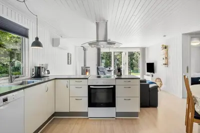 a kitchen with white cabinets and a stove top oven at JB128-Fjerritslev-Pilevej-2 in Fjerritslev
