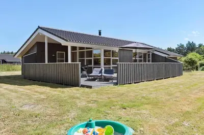 a house with a yard with a bowl in front of it at JB792-Fjerritslev-Egevej-34 in Fjerritslev