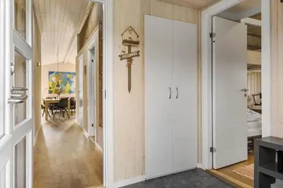 a hallway with a door leading to a dining room at JB242-Fjerritslev-Poppelvej-8 in Fjerritslev