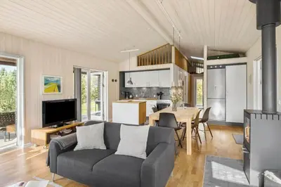 a living room with a couch and a table at JB242-Fjerritslev-Poppelvej-8 in Fjerritslev