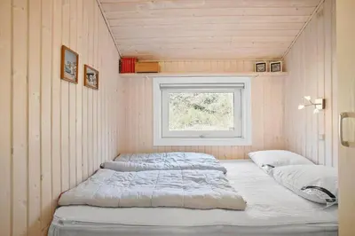 two beds in a small room with a window at JB185-Fjerritslev-Poppelvej-26 in Fjerritslev