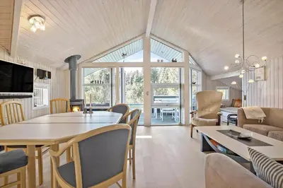 a living room with a table and a dining room at JB185-Fjerritslev-Poppelvej-26 in Fjerritslev