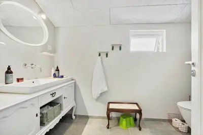 a white bathroom with a sink and a toilet at JB294-Fjerritslev-Perikumvej-72 in Fjerritslev