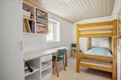 a bedroom with a desk and a bunk bed at JB640-Fjerritslev-Bjerregardsboulevarden-8 in Fjerritslev