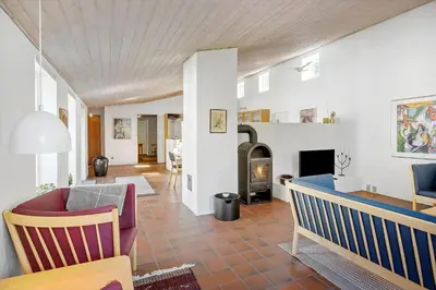 a living room with a couch and a fireplace at JB640-Fjerritslev-Bjerregardsboulevarden-8 in Fjerritslev