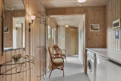 a laundry room with two chairs and a table at JB102-Fjerritslev-Blabaerstien-7 in Fjerritslev
