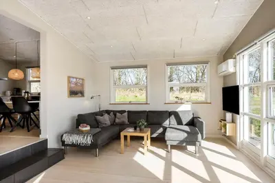 a living room with a couch and a table at JB666-Fjerritslev-Aspevej-21 in Fjerritslev