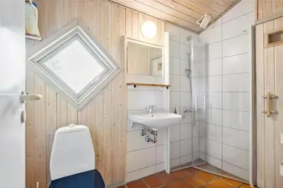 a bathroom with a toilet and a sink at JB122-Fjerritslev-Tyttebaerstien-14 in Fjerritslev