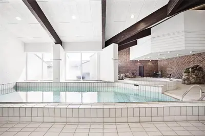 a large swimming pool in a building at JB129-Brovst-Strandvejen-150-Lejl-106 in Brovst