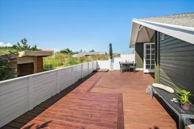 a wooden deck on the side of a house at JB116-Frostrup-Svenstibakkevej-30 in Frøstrup
