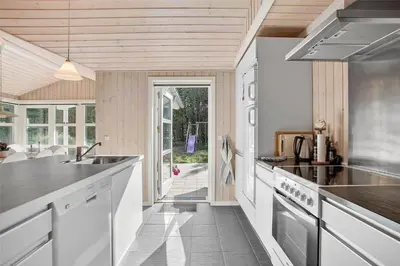 a kitchen with a sink and a counter top at JB133-Fjerritslev-Blabaerstien-35 in Fjerritslev