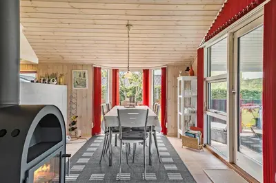 a dining room with a table and chairs at JB166-Fjerritslev-Egevej-26 in Fjerritslev
