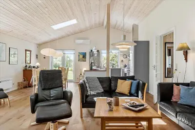 a living room with a couch and a table at JB165-Fjerritslev-Ostersvej-16 in Fjerritslev