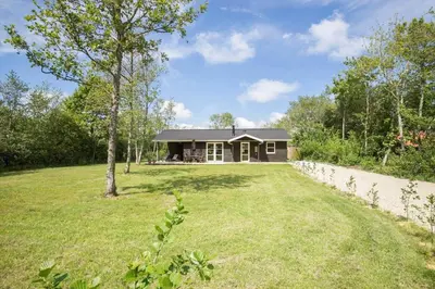a house with a large yard in front of it at JB324-Fjerritslev-Tyttebaerstien-42 in Fjerritslev