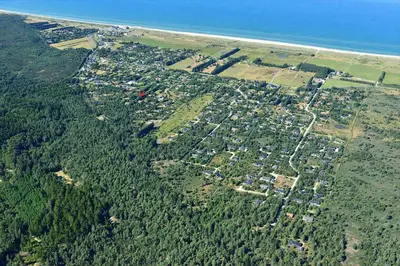an aerial view of a city with trees and the ocean at JB324-Fjerritslev-Tyttebaerstien-42 in Fjerritslev