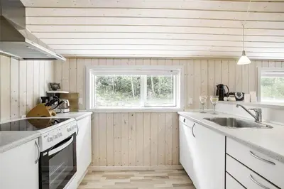 a kitchen with a sink and a stove top oven at JB243-Fjerritslev-Aspevej-1 in Fjerritslev