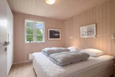 a bedroom with a bed with two pillows on it at JB283-Frostrup-Andreas-Lassens-Vej-6 in Frøstrup