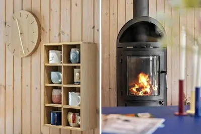 a fireplace and a book shelf with a fire in it at JB291-Fjerritslev-Stenhusvej-30 in Fjerritslev