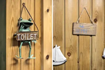 a door with a frog holding a sign that says toilet at JB391-Fjerritslev-Perikumvej-62 in Fjerritslev