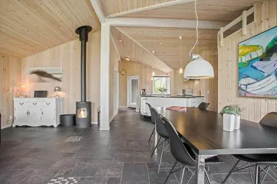 a kitchen and dining room with a table and chairs at JB888-Fjerritslev-Aspevej-15 in Fjerritslev