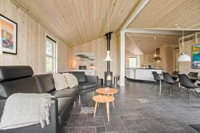 a living room with a couch and a table at JB888-Fjerritslev-Aspevej-15 in Fjerritslev