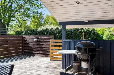 a grill sitting on top of a wooden deck at JB272-Fjerritslev-Ronnevej-14 in Fjerritslev
