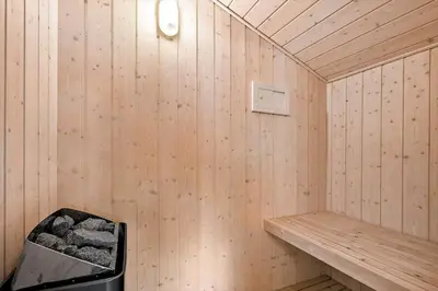 a wooden sauna with a bench and a trash can at JB188-Fjerritslev-Kollerup-Klitvej-163 in Fjerritslev