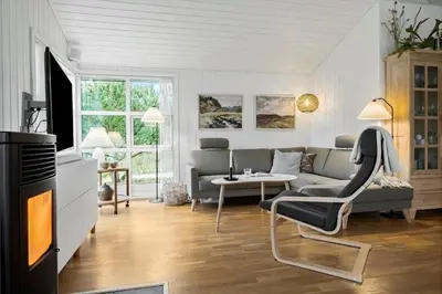 a living room with a couch and a table at JB231-Fjerritslev-Poppelvej-2 in Fjerritslev