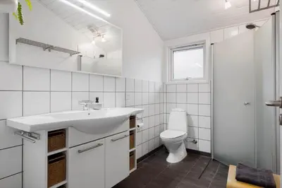 a white bathroom with a sink and a toilet at JB231-Fjerritslev-Poppelvej-2 in Fjerritslev