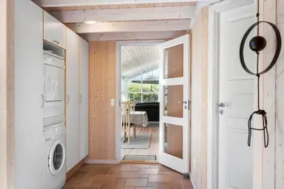 a hallway with a washer and dryer in a house at JB251-Fjerritslev-Egevej-5 in Fjerritslev