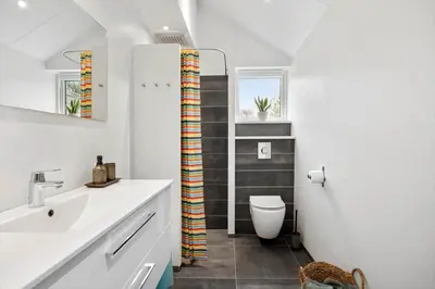 a bathroom with a toilet and a sink at JB718-Fjerritslev-Tyttebaerstien-38 in Fjerritslev