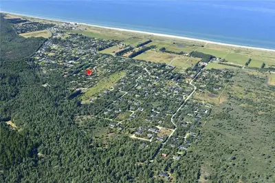 an aerial view of a city with the ocean at JB718-Fjerritslev-Tyttebaerstien-38 in Fjerritslev