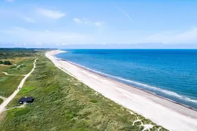 an aerial view of a beach near the ocean at JB198-Fjerritslev-Tyttebaerstien-40 in Fjerritslev
