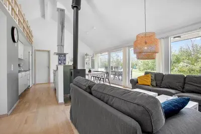 a living room with a couch and a table at JB752-Brovst-Kronvildtvej-210 in Brovst