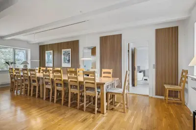 a dining room with a table and chairs at JB200-Fjerritslev-Udklitvej-168 in Fjerritslev