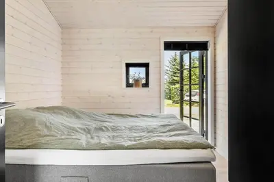 a bedroom with a bed and a window in a room at JB330-Fjerritslev-Perikumvej-12 in Fjerritslev