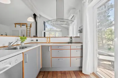 a white kitchen with a sink and a window at JB228-Brovst-Ildervej-14 in Brovst