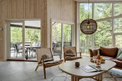 a living room with a couch and a table at JB351-Fjerritslev-Revlingestien-77 in Fjerritslev