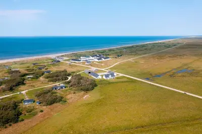 an aerial view of a house next to the ocean at JB358-Brovst-Strandvejen-150-Lejl-126 in Brovst