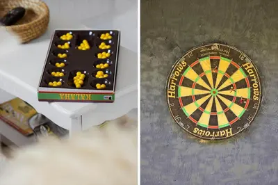 a dart board and a box of balls on a table at JB401-Brovst-Solsortevej-1 in Brovst