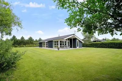 a house with a large lawn in front of it at JB209-Fjerritslev-Egevej-22 in Fjerritslev
