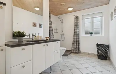 a white bathroom with a toilet and a shower at Pet Friendly Home In Vestervig With Sauna in Vestervig