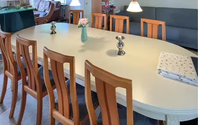 a table with chairs and a vase of flowers on it at Pet Friendly Home In Struer With Wifi in Struer
