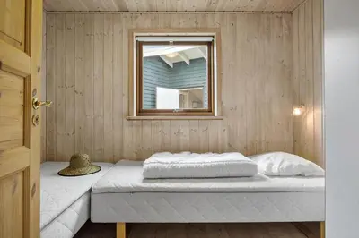 a bed in a room with a window at JB363-Fjerritslev-Tolderstien-8 in Fjerritslev